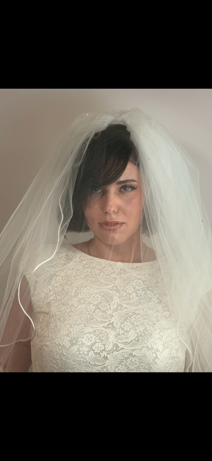 Bride in veil with soft romantic makeup
