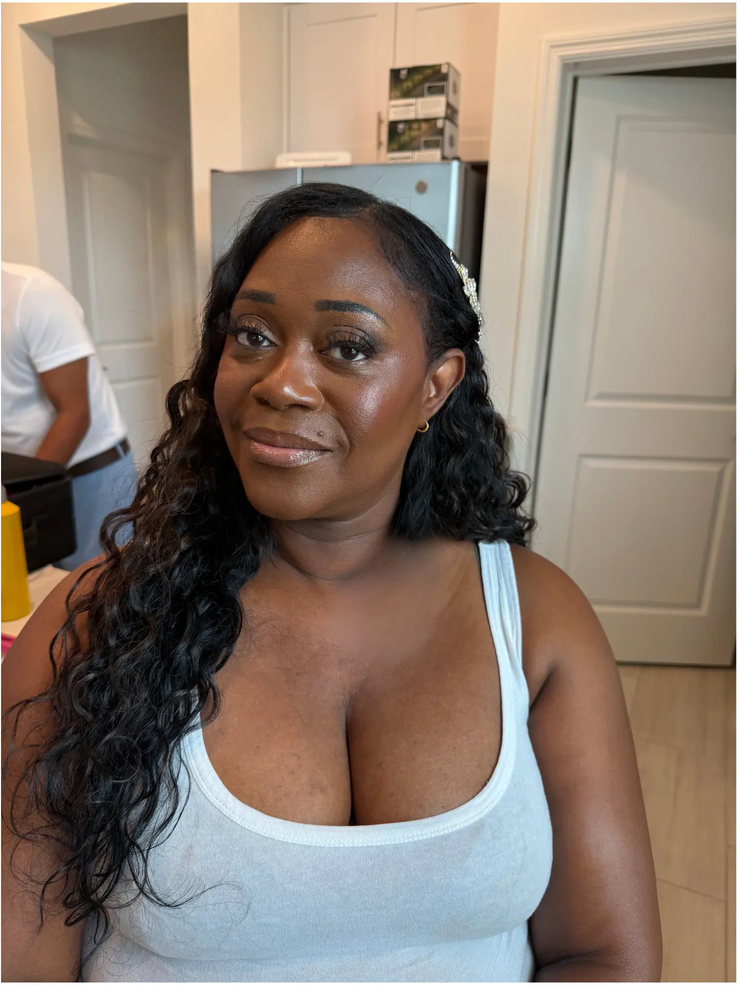 Glowing bridal glam with curled half-up style