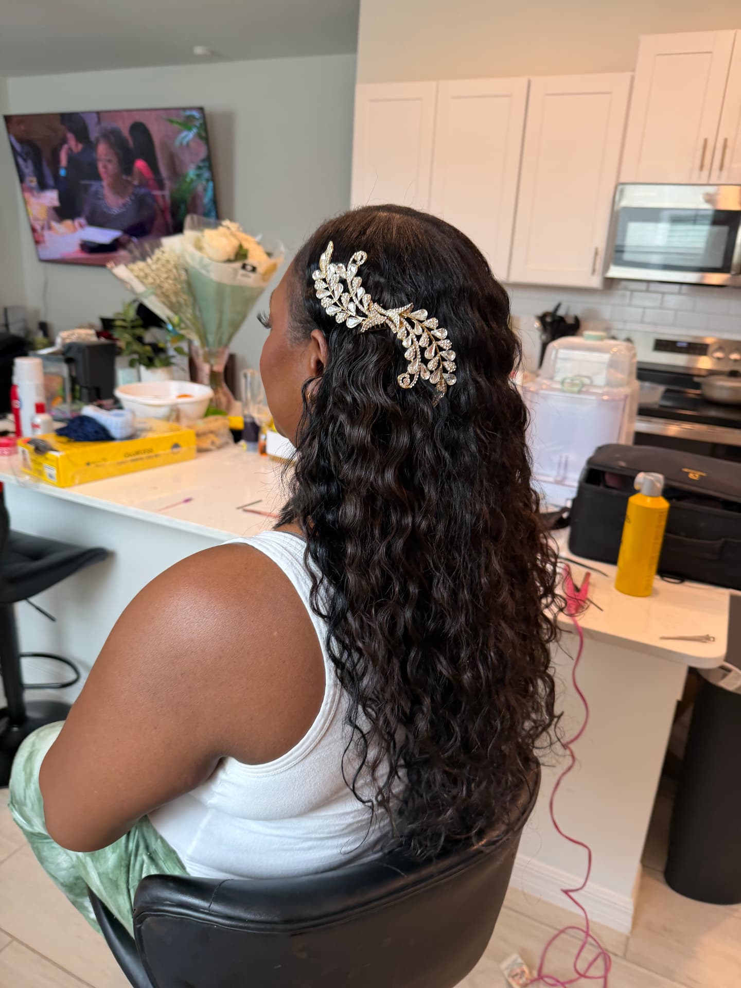 Curly bridal half-up with jeweled hair vine