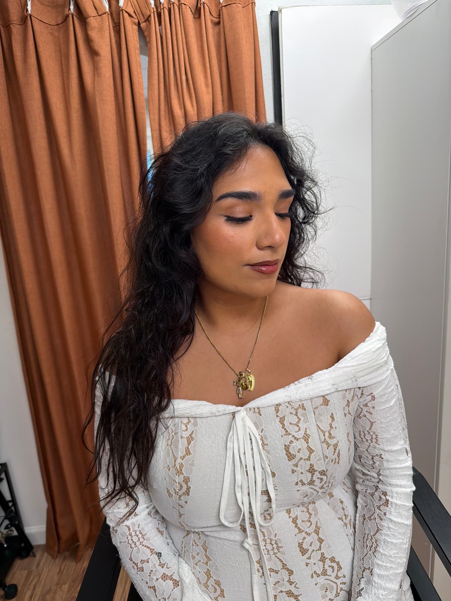 Soft bronzed glam with tousled dark waves